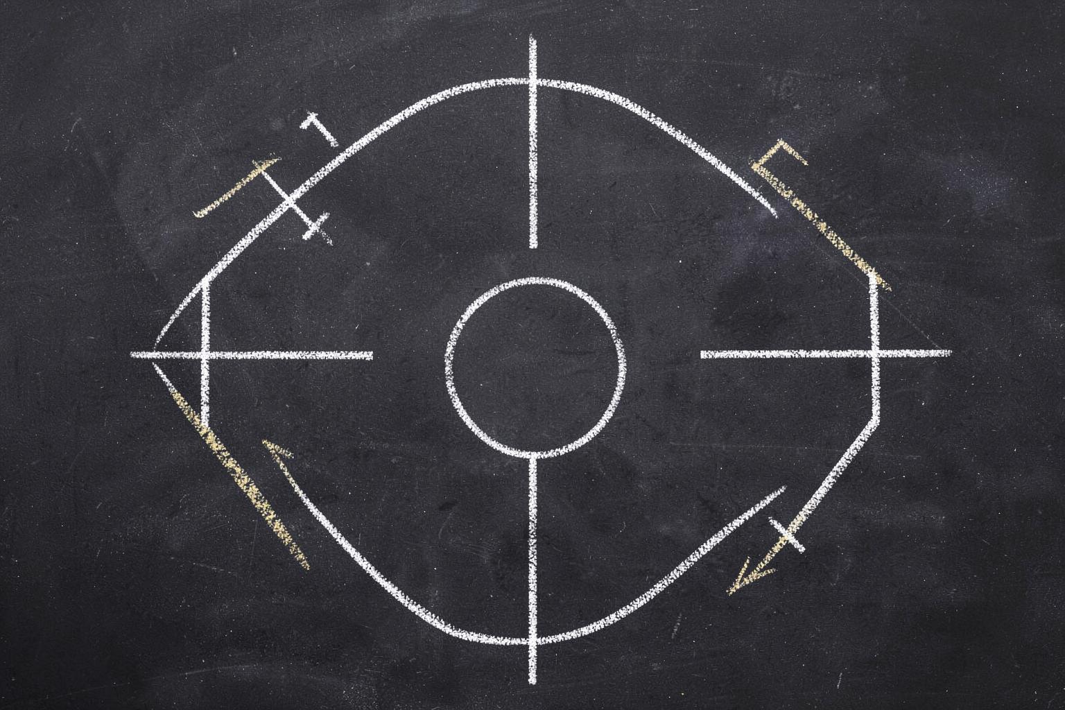 Chalkboard football play diagram with Xs, Os, and route lines